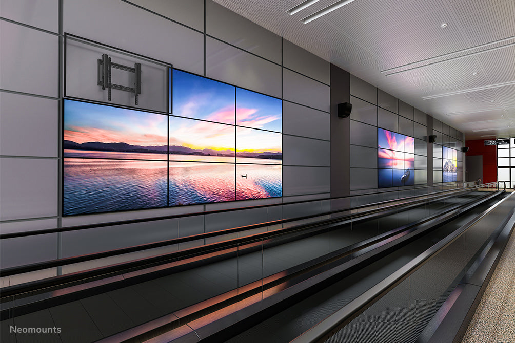 Neomounts LED-VW2500 zwart1 è un supporto a parete piatto per video wall per schermi fino a 75 pollici (191 cm), per montaggio orizzontale e verticale - Nero